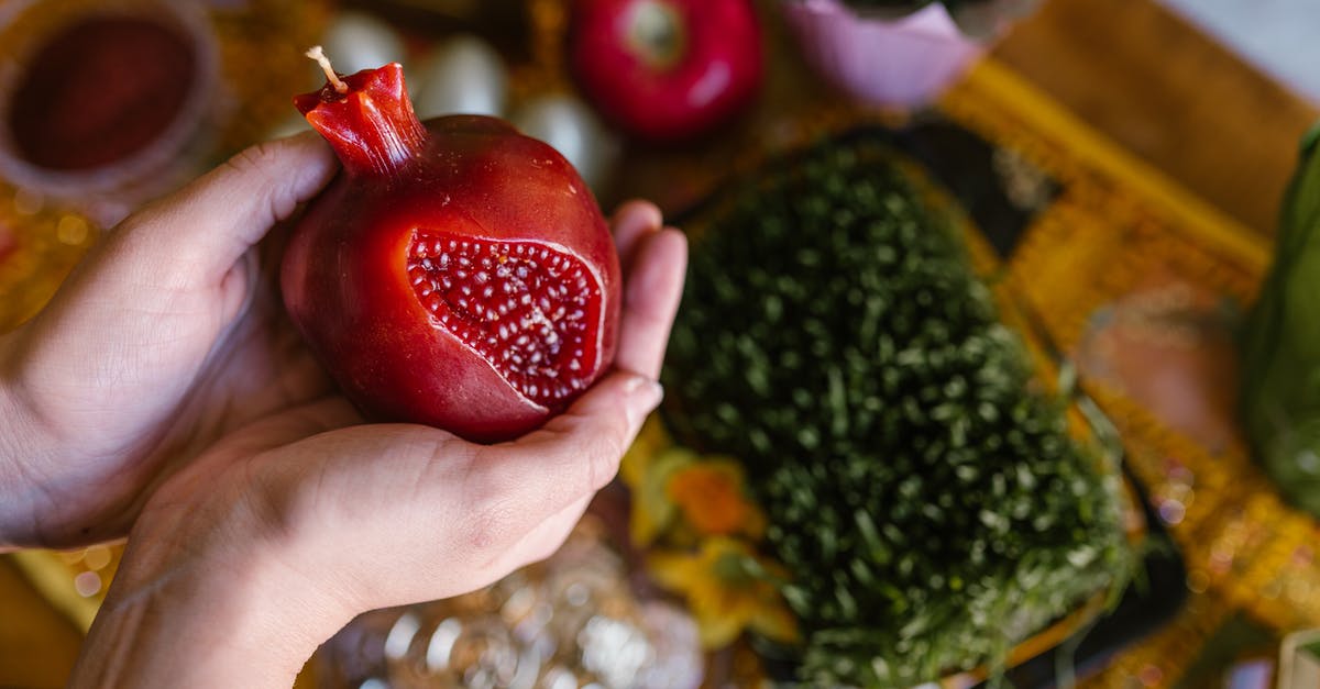 Bringing food items into the UK (from Chile) - Person Holding A Fruit Shaped Red Candle Bringing food items into the UK (from Chile) - Person Holding A Fruit Shaped Red Candle
