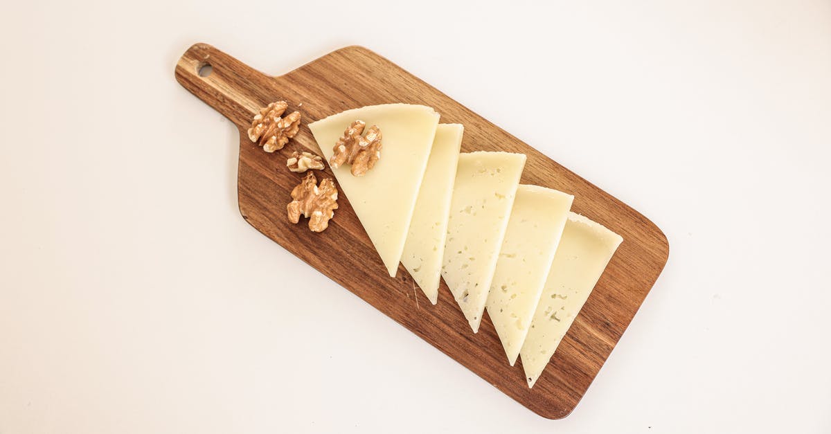 Bringing food items into the UK (from Chile) - White Cheese on Brown Wooden Chopping Board Bringing food items into the UK (from Chile) - White Cheese on Brown Wooden Chopping Board