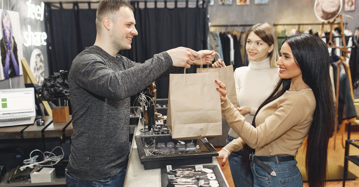 Bringing souvenirs for other through UK Customs to give on board ship? - Female customers getting paper bags at counter desk