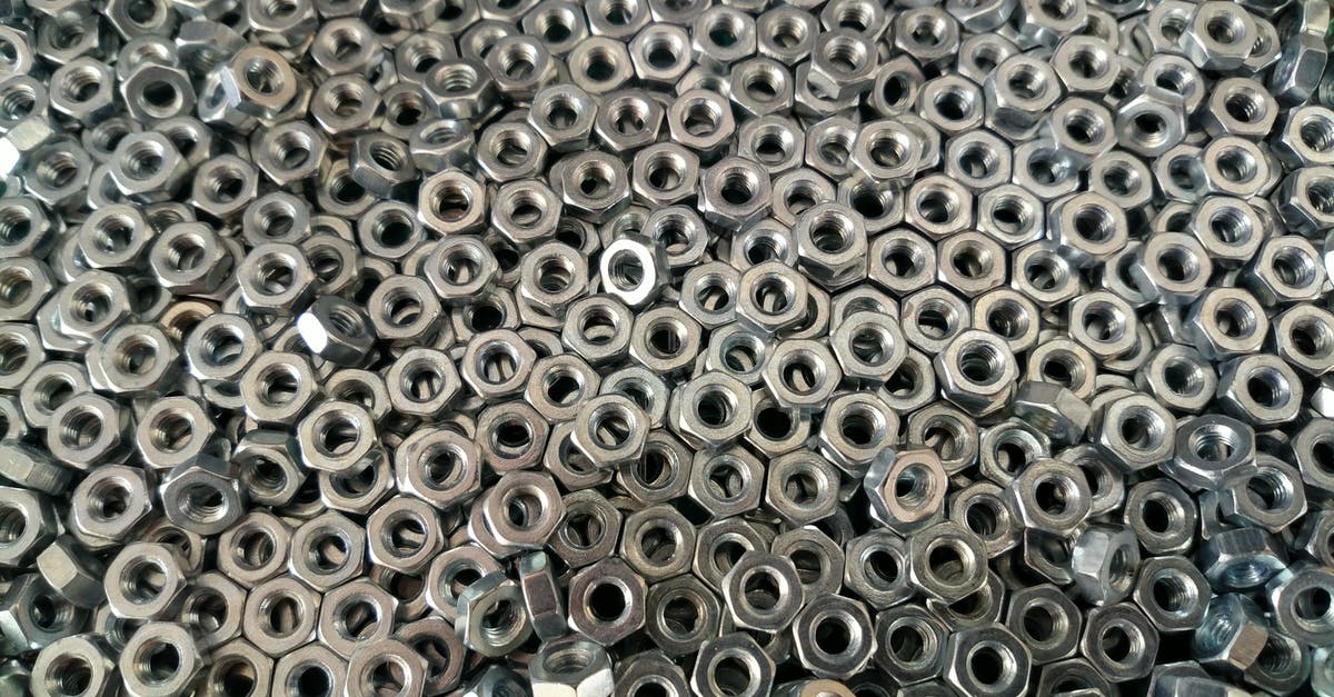 Bringing titanium alloy in luggage? - Pile of Silver Hex Nuts Bringing titanium alloy in luggage? - Pile of Silver Hex Nuts