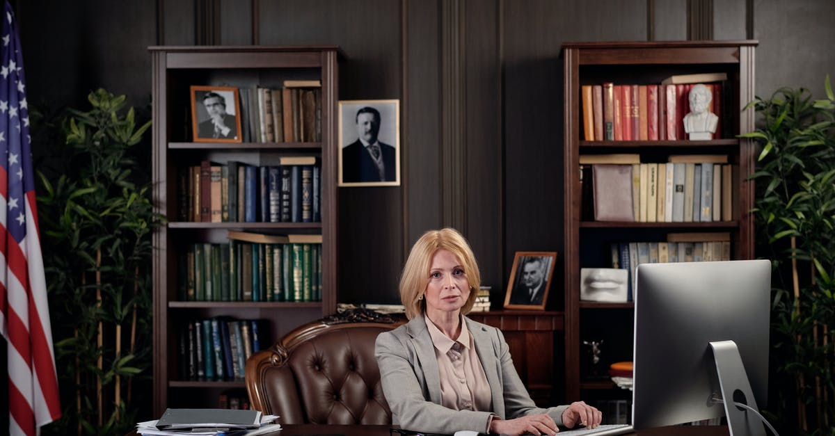 Bringing used computers/phones from USA to Romania as gifts - Woman Sitting at her Office Bringing used computers/phones from USA to Romania as gifts - Woman Sitting at her Office