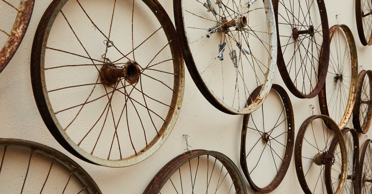 Broken baggage form - Spoke wheels hanging on wall Broken baggage form - Spoke wheels hanging on wall