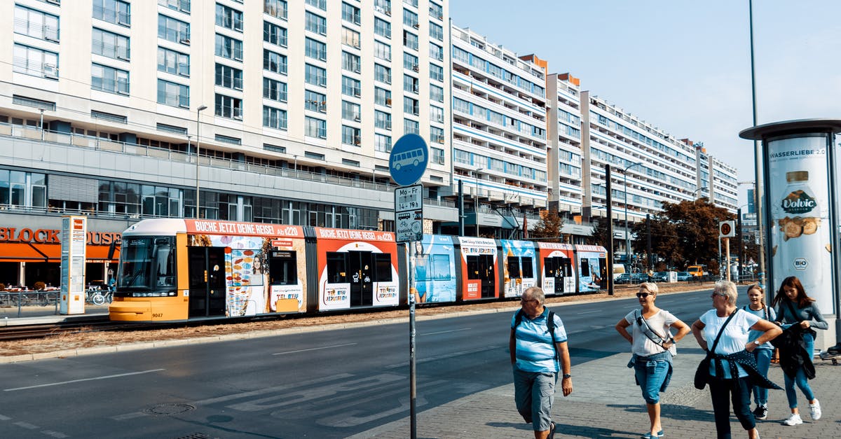 Bus search engines for Germany without place of arrival? - People Walking on Sidewalk Near White Concrete Building Bus search engines for Germany without place of arrival? - People Walking on Sidewalk Near White Concrete Building