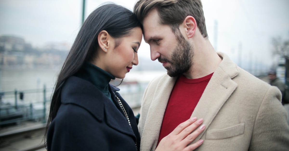 Business Invitation Date only 8 days before Visa Submission - Happy multiracial couple hugging on waterfront while having romantic date in city Business Invitation Date only 8 days before Visa Submission - Happy multiracial couple hugging on waterfront while having romantic date in city