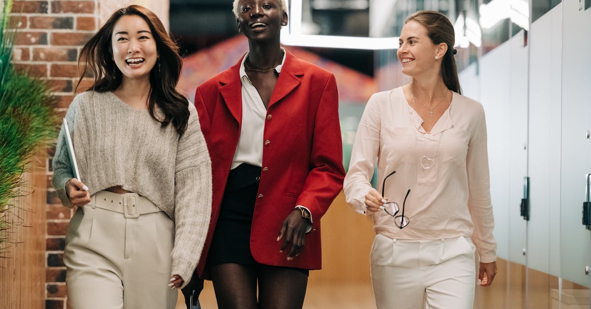 Business visa validity after I switch organization - Successful multiethnic business colleagues in modern office Business visa validity after I switch organization - Successful multiethnic business colleagues in modern office