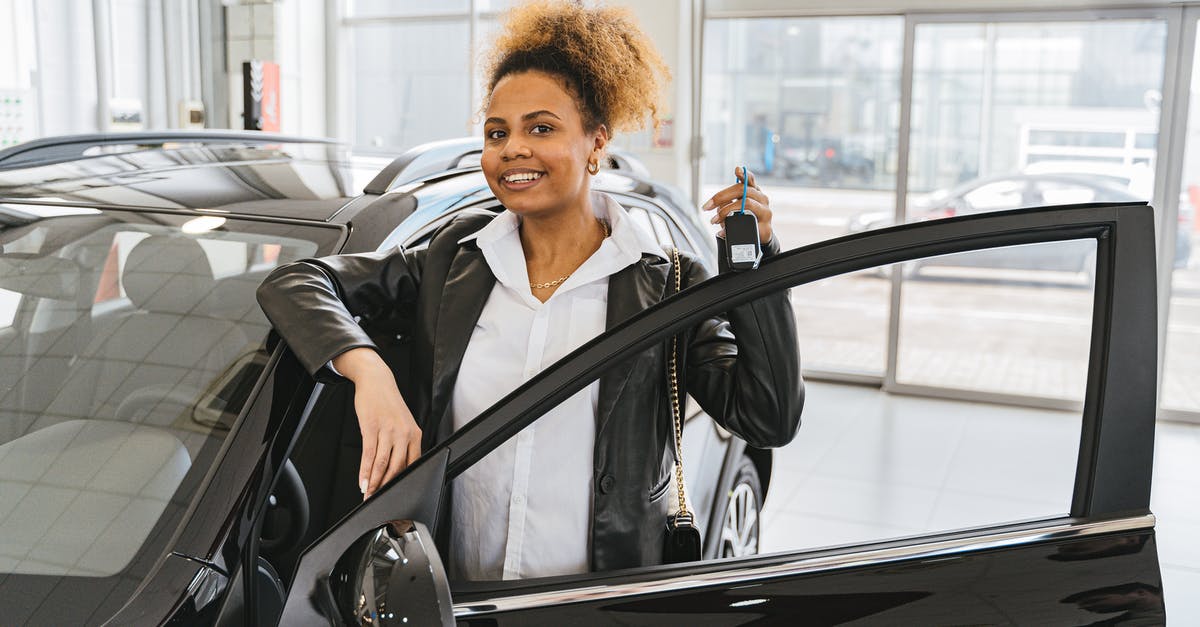 Buying a car in Australia or New Zealand as a non-resident? [closed] - Woman in Black Blazer Standing Beside Black Car