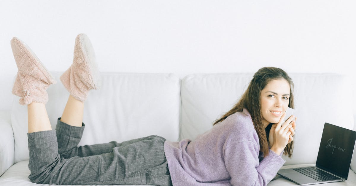 Buying a SIM card on arrival in Amsterdam - A Woman Lying on Sofa Online Shopping Buying a SIM card on arrival in Amsterdam - A Woman Lying on Sofa Online Shopping