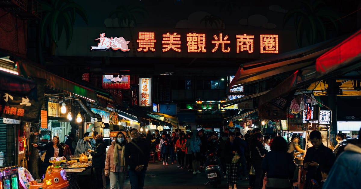 Buying photographic equipment in Taipei - People at a Night Market Buying photographic equipment in Taipei - People at a Night Market