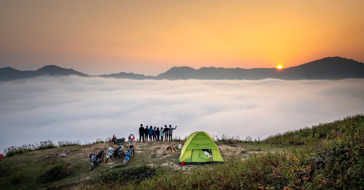 Cabins and camping options in Tatra mountains - People Standing on Cliff Looking at Sea of Clouds Cabins and camping options in Tatra mountains - People Standing on Cliff Looking at Sea of Clouds