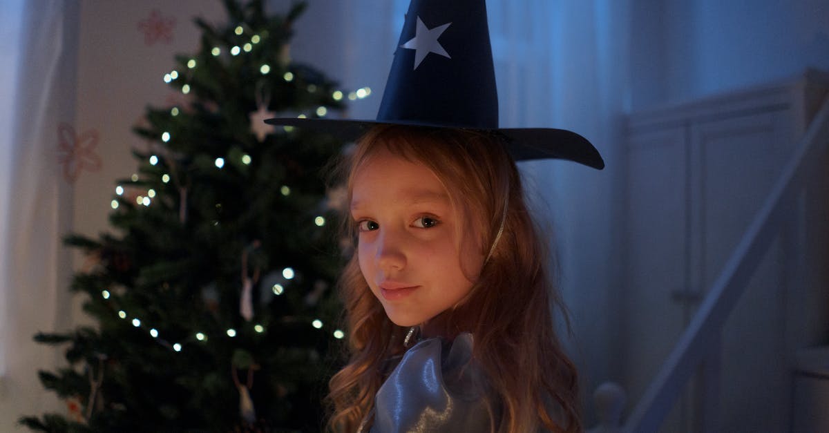 Cambodian visa extension for children - Girl in Black Cowboy Hat Standing Beside Green Christmas Tree Cambodian visa extension for children - Girl in Black Cowboy Hat Standing Beside Green Christmas Tree