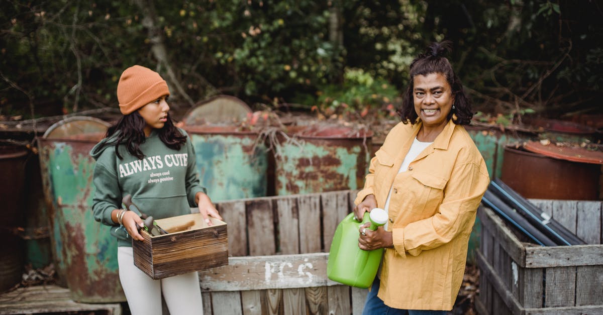 Can't check-in on Ryanair, because an adult is registered as a teen and a teen is registered as an adult - Content ethnic gardener with daughter near rusty containers on farm Can't check-in on Ryanair, because an adult is registered as a teen and a teen is registered as an adult - Content ethnic gardener with daughter near rusty containers on farm