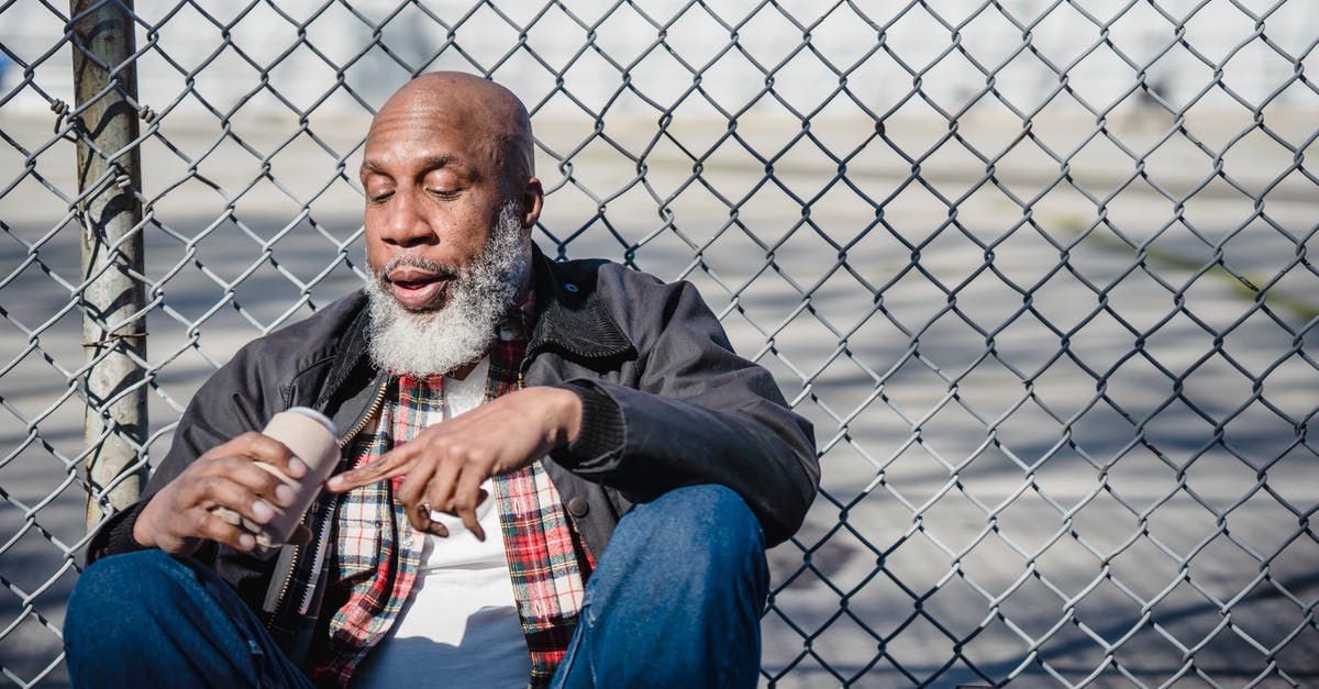 Can a dual citizen disregard border controls? - Hairless black male looking at beer can in hand against mesh fence in daylight Can a dual citizen disregard border controls? - Hairless black male looking at beer can in hand against mesh fence in daylight