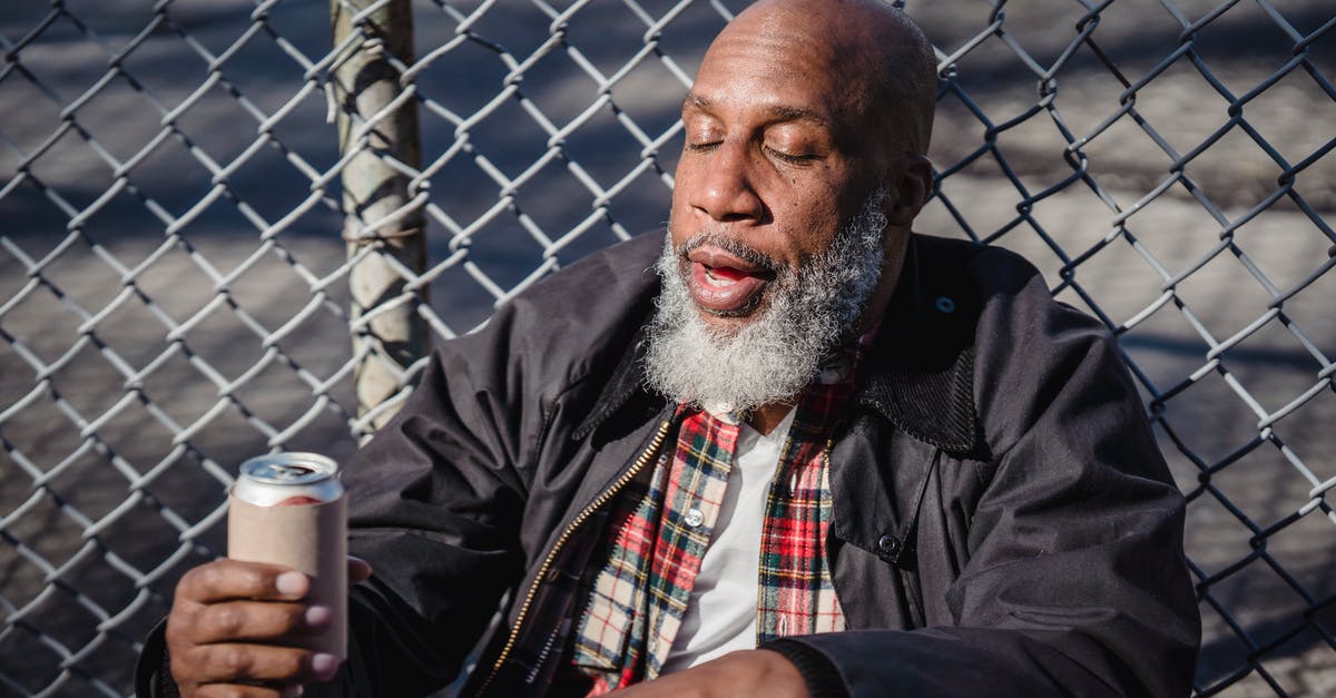 Can a dual citizen disregard border controls? - African American homeless man holding beer on street Can a dual citizen disregard border controls? - African American homeless man holding beer on street