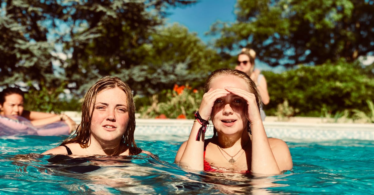 Can a family pool their duty free allowances entering Australia? - Two Women in Swimming Pool Near Trees Can a family pool their duty free allowances entering Australia? - Two Women in Swimming Pool Near Trees