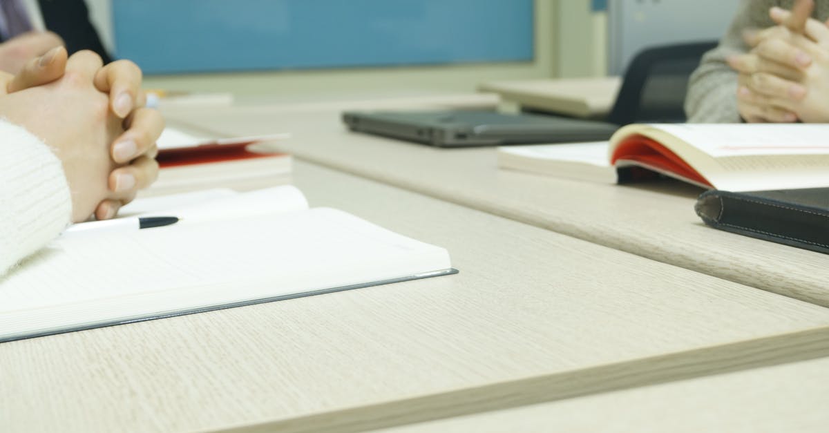 Can a J2 visa holder work remotely for a french company without applying for an EAD? [closed] - Open Book With Person's Hand on Top