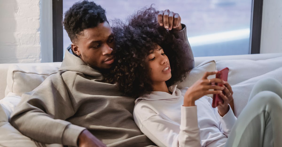 Can a mixed-Muslim unmarried couple share hotel rooms in Indonesia? - Young black woman resting together with boyfriend and using smartphone Can a mixed-Muslim unmarried couple share hotel rooms in Indonesia? - Young black woman resting together with boyfriend and using smartphone
