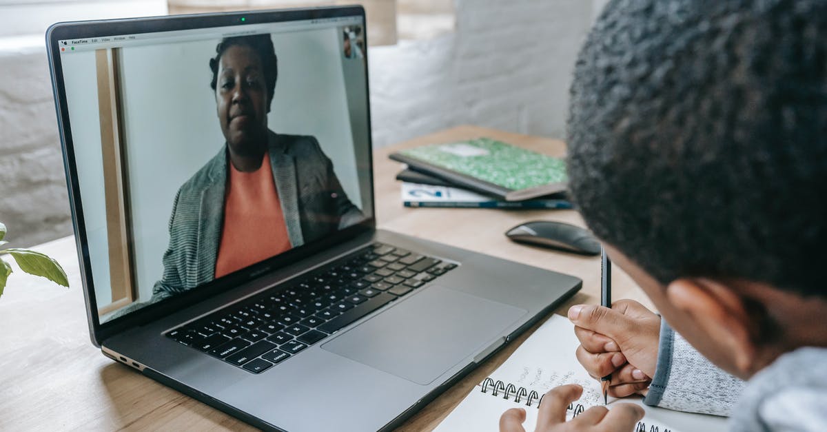 Can a proctored online COVID antigen test be used to travel to the Netherlands? - Side view of crop anonymous African American boy having test while teacher explaining information online on laptop