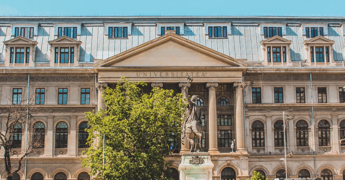 Can a student studying in U.K (with a visa) travel to Germany (with a Schengen visa) during the current travel restrictions? - People Walking Near Brown Concrete Building