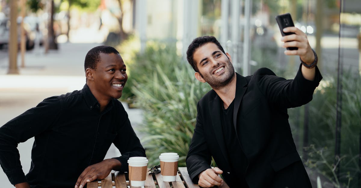 Can a US citizen make a connection in Brazil without a visa or transfer visa - Man in Black Suit Jacket Smiling Beside Woman in Black Long Sleeve Shirt Can a US citizen make a connection in Brazil without a visa or transfer visa - Man in Black Suit Jacket Smiling Beside Woman in Black Long Sleeve Shirt