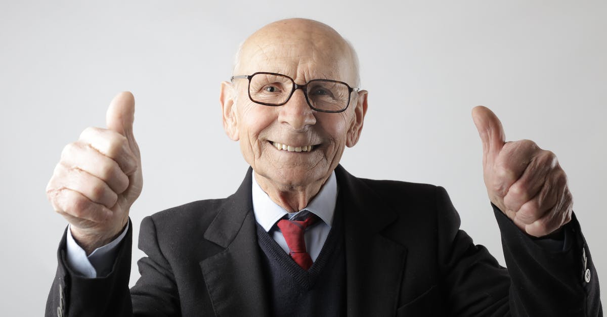 Can anyone recommend a good trekking tour for Machu Picchu? - Positive senior man in eyeglasses showing thumbs up and looking at camera Can anyone recommend a good trekking tour for Machu Picchu? - Positive senior man in eyeglasses showing thumbs up and looking at camera