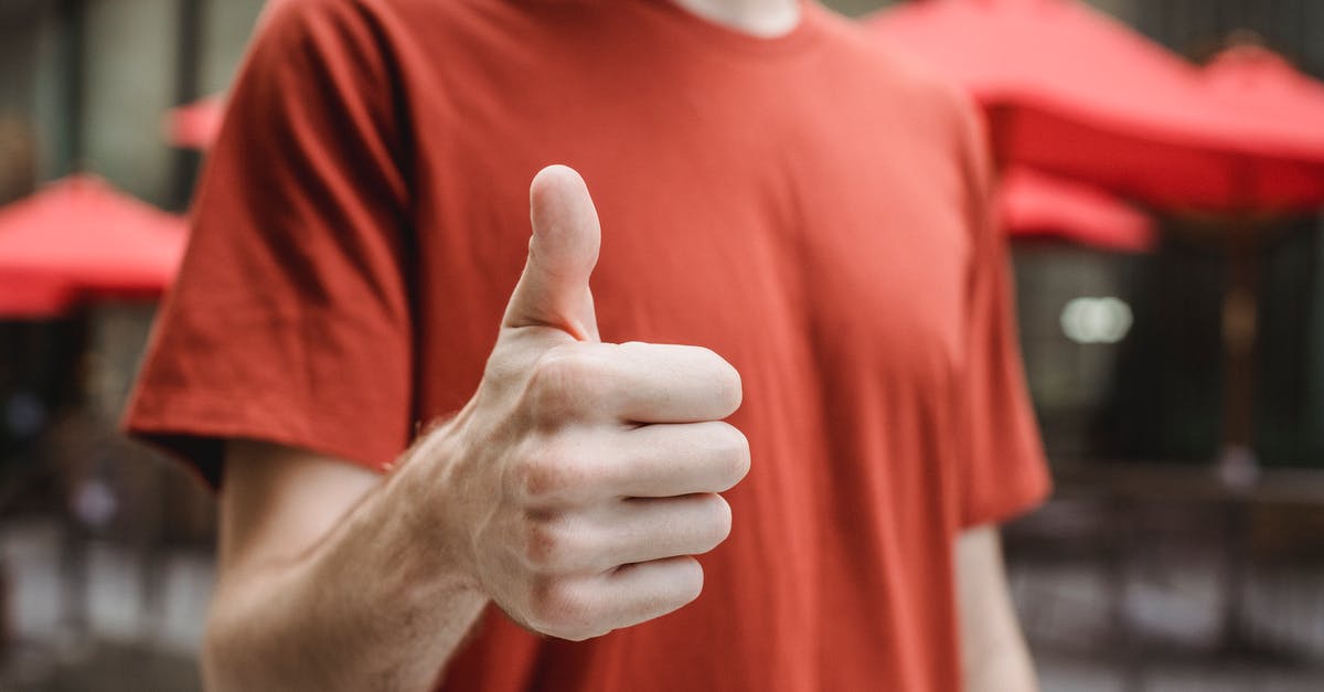 Can anyone recommend a good trekking tour for Machu Picchu? - Crop anonymous young male in red t shirt showing thumb up gesture while standing on city street on sunny day Can anyone recommend a good trekking tour for Machu Picchu? - Crop anonymous young male in red t shirt showing thumb up gesture while standing on city street on sunny day