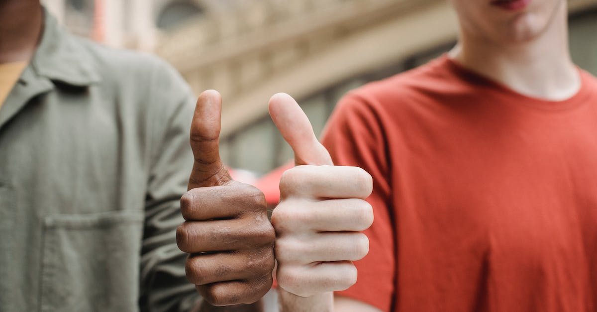 Can anyone recommend a good trekking tour for Machu Picchu? - Unrecognizable multiracial guys showing thumbs up gesture Can anyone recommend a good trekking tour for Machu Picchu? - Unrecognizable multiracial guys showing thumbs up gesture