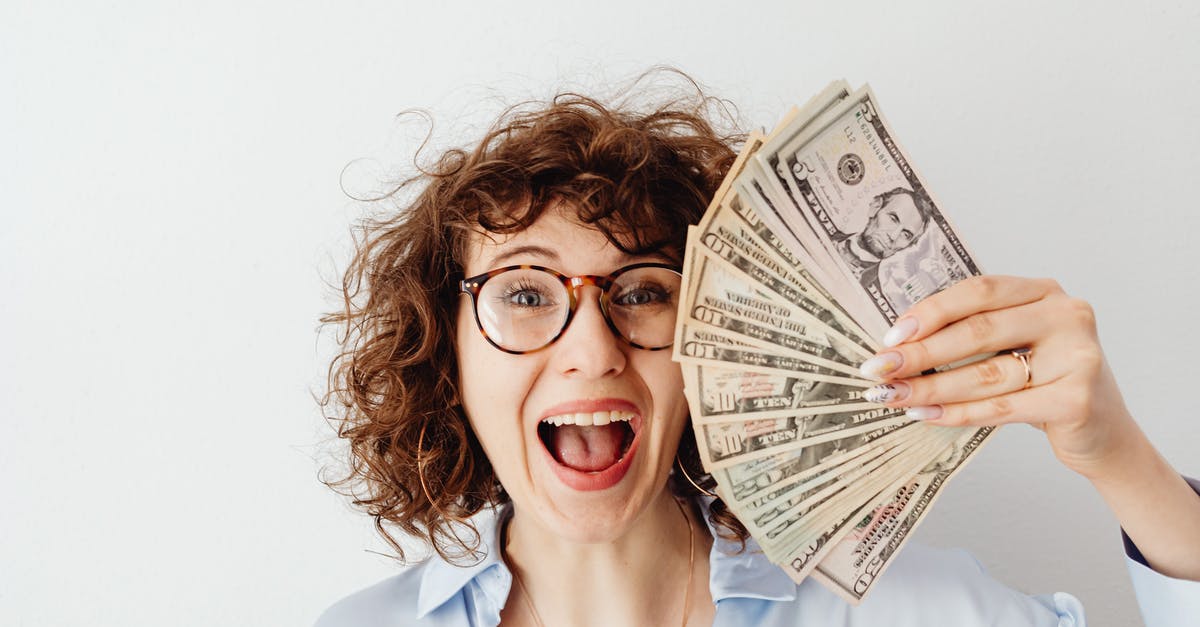 Can Canadian money (change) be used in the United States? - Happy Woman in Blue Long Sleeve Blouse Holding Money Can Canadian money (change) be used in the United States? - Happy Woman in Blue Long Sleeve Blouse Holding Money