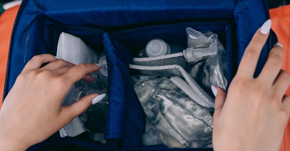 Can cheese in hand luggage be mistaken for plastic explosive? - Person Holding White Plastic Lid Can cheese in hand luggage be mistaken for plastic explosive? - Person Holding White Plastic Lid