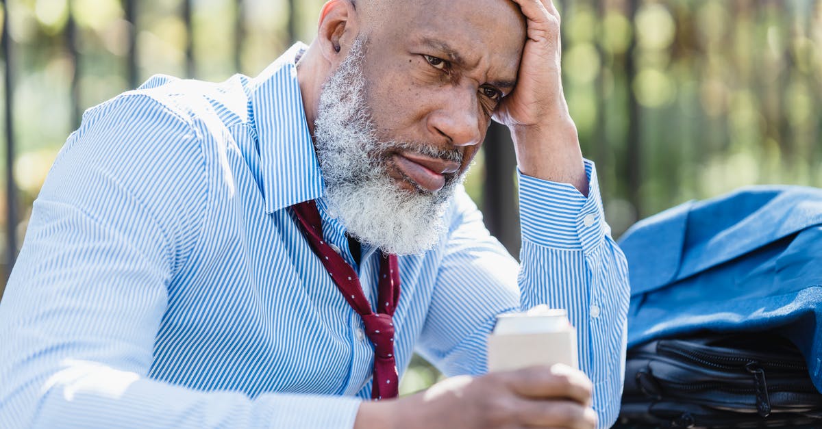 Can departing earlier than scheduled cause problems with UK Immigration? - Sad black businessman with alcohol drink on street Can departing earlier than scheduled cause problems with UK Immigration? - Sad black businessman with alcohol drink on street
