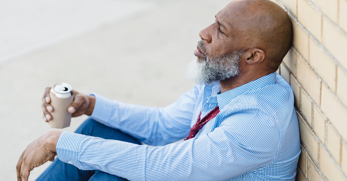 Can departing earlier than scheduled cause problems with UK Immigration? - Depressed black male with beer can leaning on brick wall Can departing earlier than scheduled cause problems with UK Immigration? - Depressed black male with beer can leaning on brick wall