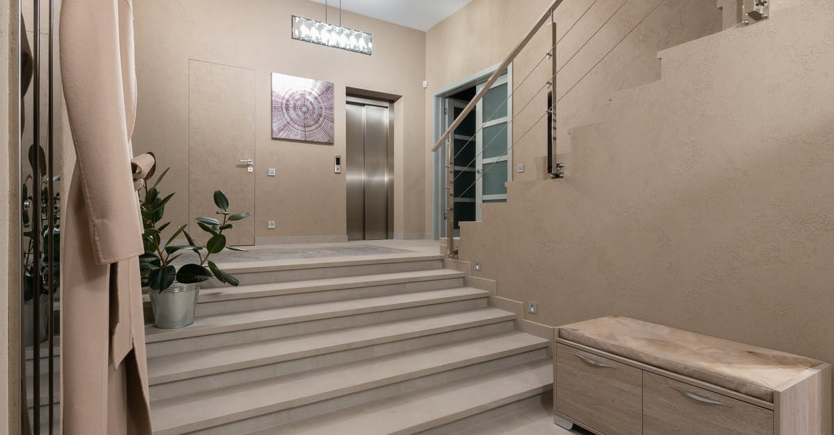 Can EU nationals enter and exit Albania with EU ID card? - Spacious hallway of contemporary apartment with beige walls and wide stairway under glowing lamps Can EU nationals enter and exit Albania with EU ID card? - Spacious hallway of contemporary apartment with beige walls and wide stairway under glowing lamps
