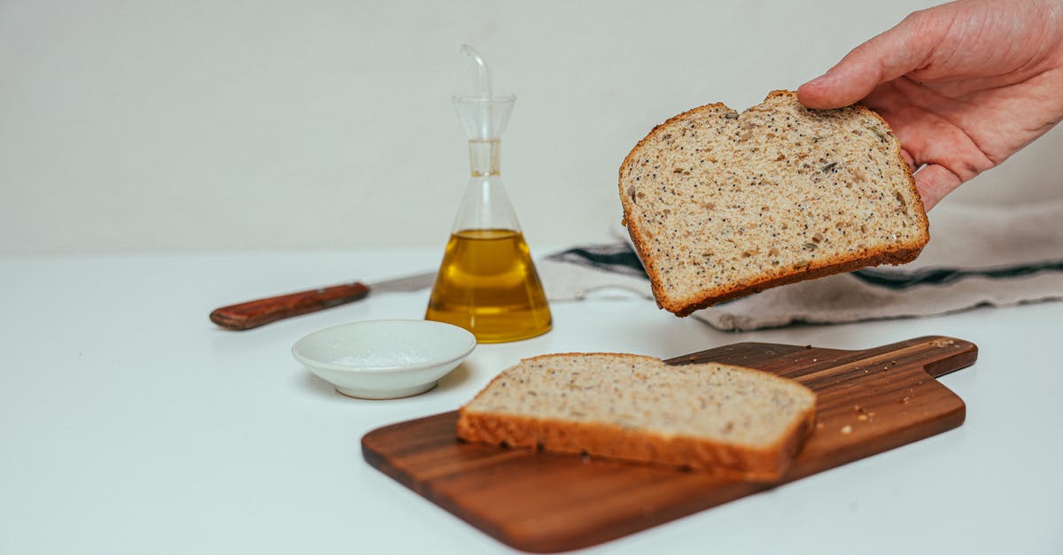 Can I accompany my mother-in-law until getting boarding passes at Heathrow? - A Person Holding a Slice of Bread Beside a Dispenser with Yellow Liquid Can I accompany my mother-in-law until getting boarding passes at Heathrow? - A Person Holding a Slice of Bread Beside a Dispenser with Yellow Liquid