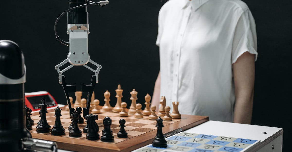 Can I accompany my mother-in-law until getting boarding passes at Heathrow? - A Robotic Arm Picking up a Chess Piece on a Chessboard Can I accompany my mother-in-law until getting boarding passes at Heathrow? - A Robotic Arm Picking up a Chess Piece on a Chessboard