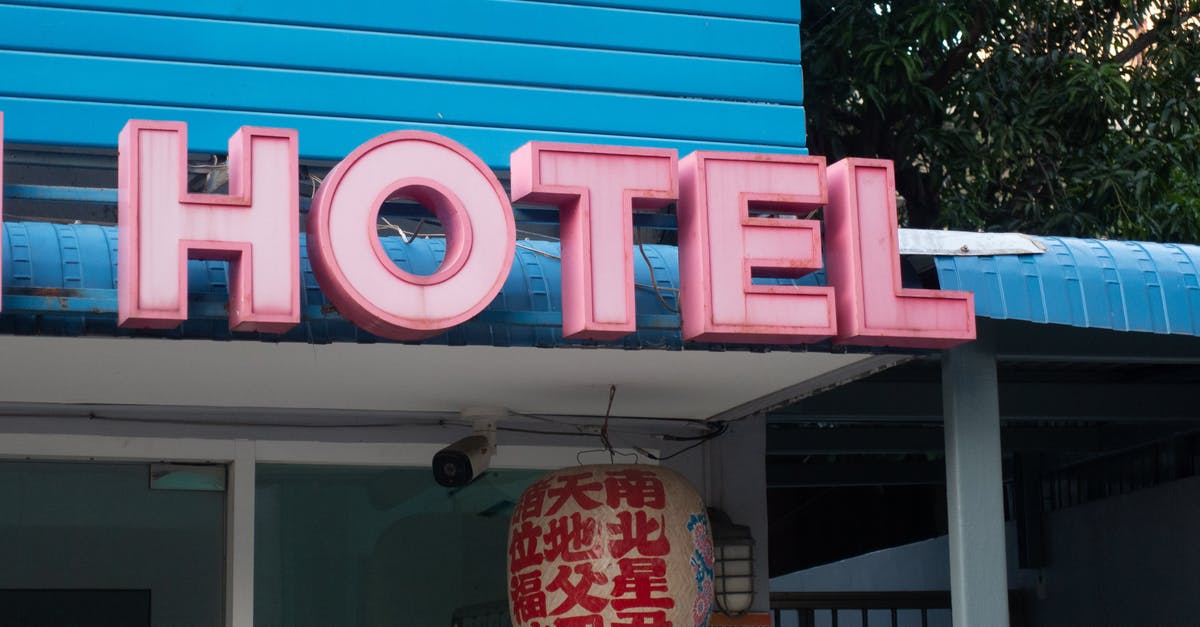Can I apply for a tourist Schengen visa but then cancel the hotel bookings and stay at my friend's place? [duplicate] - Red and Blue Unks Signage