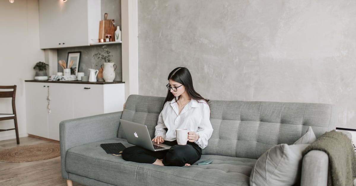 Can I apply Schengen visa as a family member of EU citizen from Netherland Embassy in Malysia while I am living in Pakistan? - Woman Sitting On Sofa While Working At Home Can I apply Schengen visa as a family member of EU citizen from Netherland Embassy in Malysia while I am living in Pakistan? - Woman Sitting On Sofa While Working At Home
