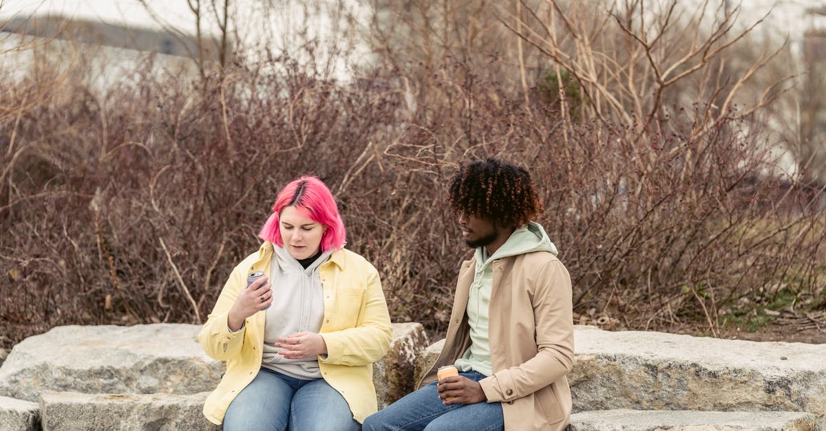 Can I ask for an earlier UK visa start date? - Diverse couple with sodas on street Can I ask for an earlier UK visa start date? - Diverse couple with sodas on street