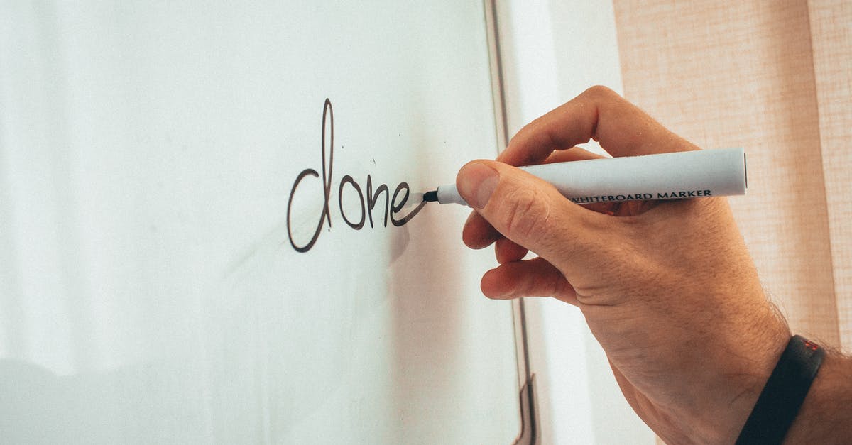 Can I attend a company training on a B1/B2 Visa? - Crop unrecognizable male coach writing done word on whiteboard during presentation in light office Can I attend a company training on a B1/B2 Visa? - Crop unrecognizable male coach writing done word on whiteboard during presentation in light office