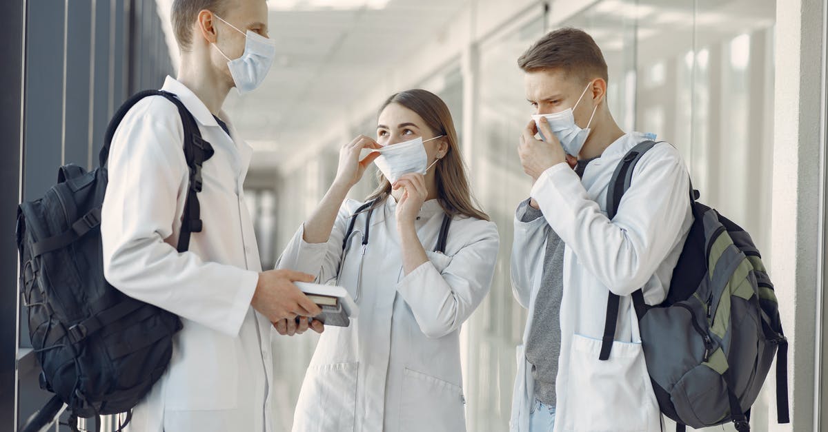 Can I attend a short training course for medical professionals on a UK standard visitor visa? - Group of Medical Students at the Hallway Wearing Face Mask