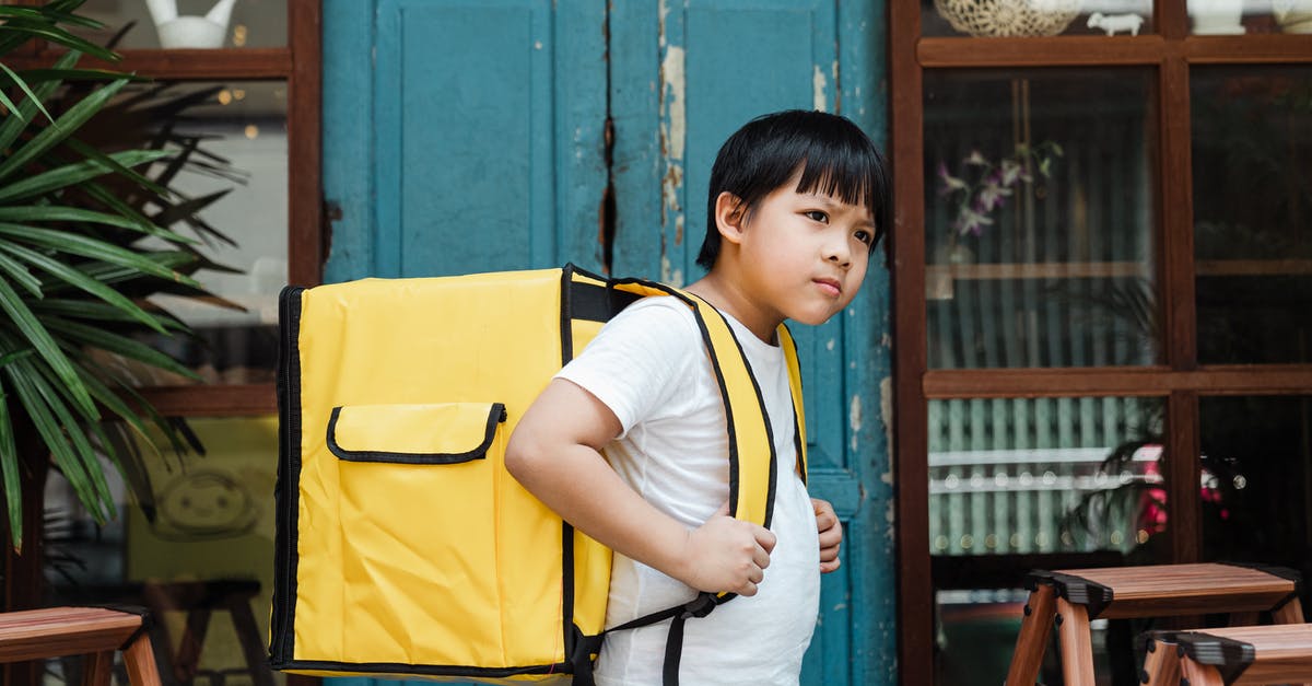 Can I bring a big wooden sword as carry on in a plane? - Ethnic boy with heavy food backpack near shabby entrance door Can I bring a big wooden sword as carry on in a plane? - Ethnic boy with heavy food backpack near shabby entrance door
