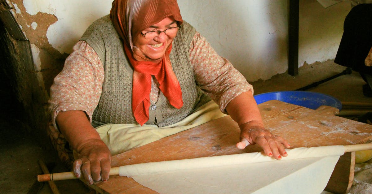 Can I bring a wooden dough rolling stick onto the plane(carry-on)? - Woman Wearing a Headscarf Rolling a Dough Can I bring a wooden dough rolling stick onto the plane(carry-on)? - Woman Wearing a Headscarf Rolling a Dough