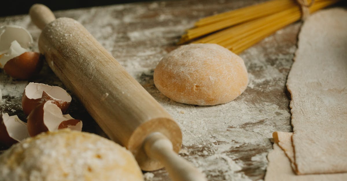 Can I bring a wooden dough rolling stick onto the plane(carry-on)? - Uncooked balls of dough near rolling pin placed on wooden table sprinkled with flour with eggshell and raw spaghetti in kitchen Can I bring a wooden dough rolling stick onto the plane(carry-on)? - Uncooked balls of dough near rolling pin placed on wooden table sprinkled with flour with eggshell and raw spaghetti in kitchen