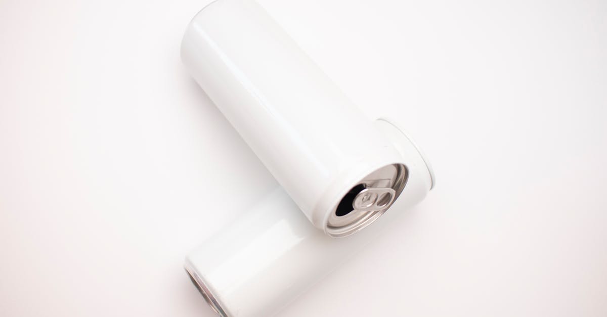 Can I bring compressed air cans in the airport? - White Cans on White Surface Can I bring compressed air cans in the airport? - White Cans on White Surface