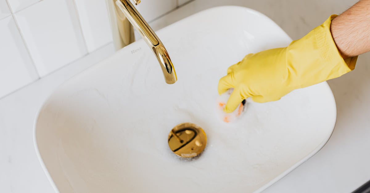 Can I bring duty free liquids through LIM-CDG-LHR? - Person in glove using sponge with detergent for cleaning sink Can I bring duty free liquids through LIM-CDG-LHR? - Person in glove using sponge with detergent for cleaning sink