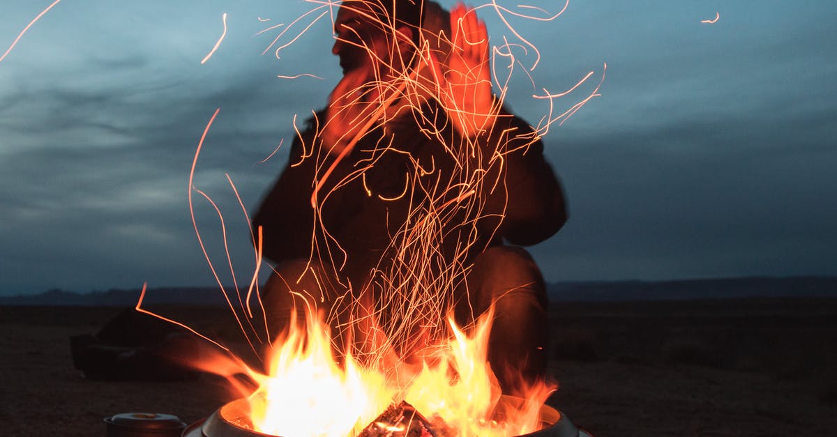 Can I bring methylated spirits camping fuel into Russia? - Man Sitting Facing Fire in Pot during Night Can I bring methylated spirits camping fuel into Russia? - Man Sitting Facing Fire in Pot during Night