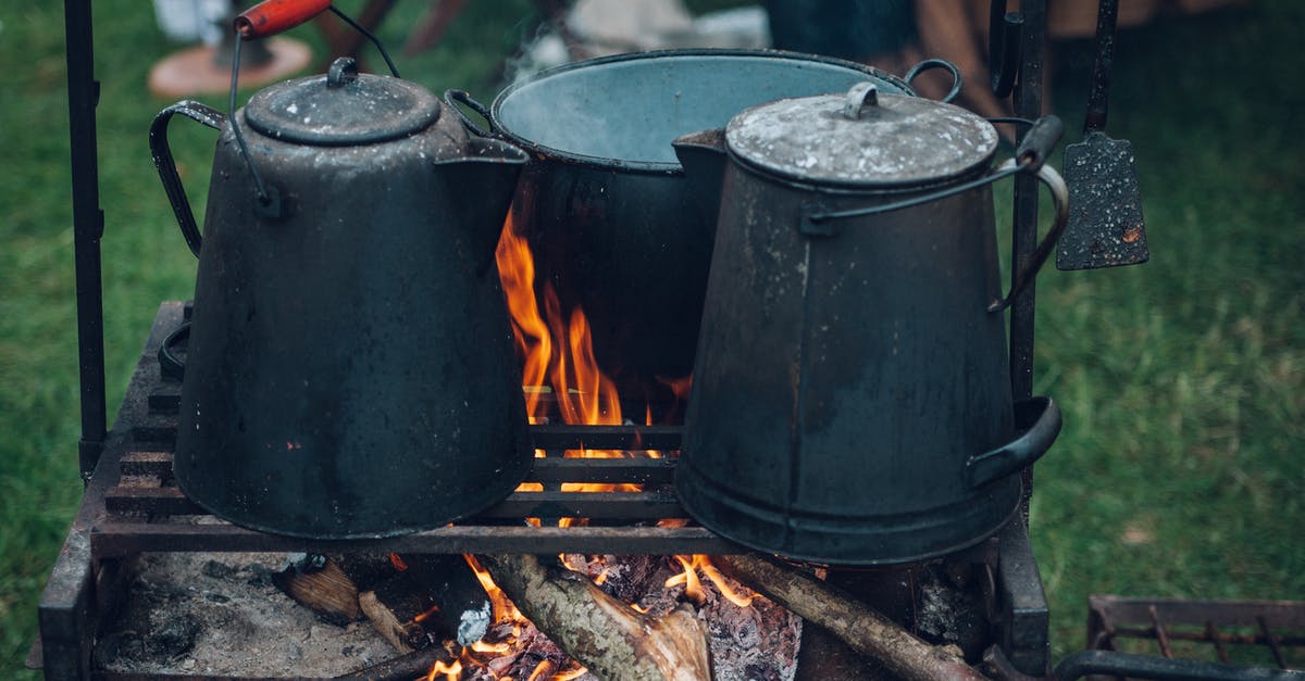 Can I bring methylated spirits camping fuel into Russia? - Three Black and Gray Pots on Top of Grill With Fire on Focus Photo Can I bring methylated spirits camping fuel into Russia? - Three Black and Gray Pots on Top of Grill With Fire on Focus Photo