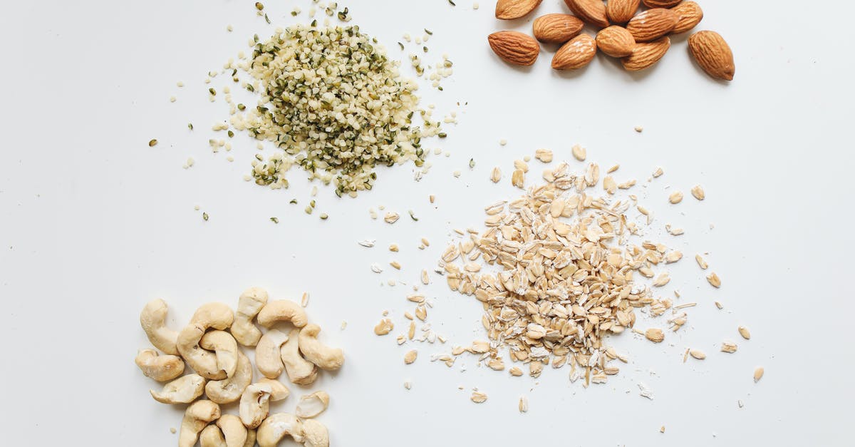 Can I bring nuts and cooked sausage from Brazil to Germany? - Brown and White Nuts on White Surface Can I bring nuts and cooked sausage from Brazil to Germany? - Brown and White Nuts on White Surface