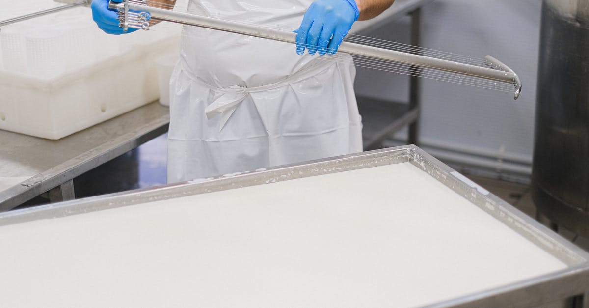 Can I bring Swiss cheese into Canada? - Person in White Scrub Suit Holding Blue and White Stick Can I bring Swiss cheese into Canada? - Person in White Scrub Suit Holding Blue and White Stick