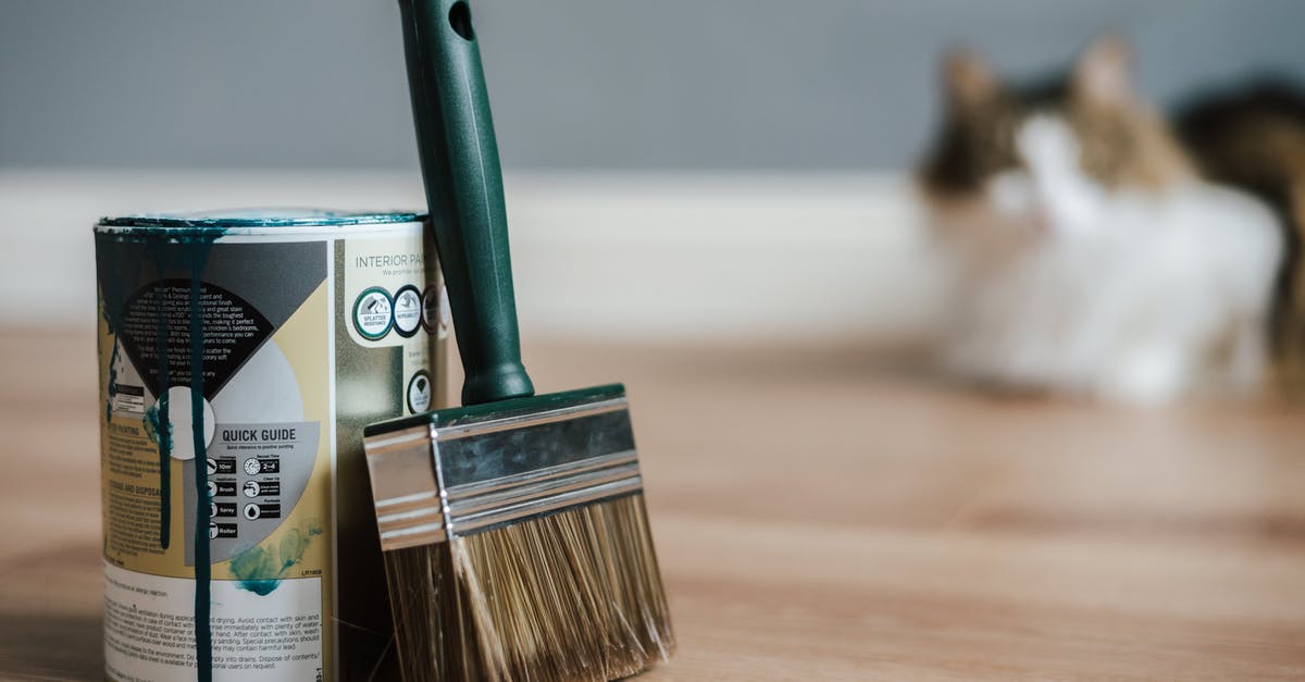 Can I bring this metal gift by airplane to Australia? - Paint brush near can on floor at home Can I bring this metal gift by airplane to Australia? - Paint brush near can on floor at home