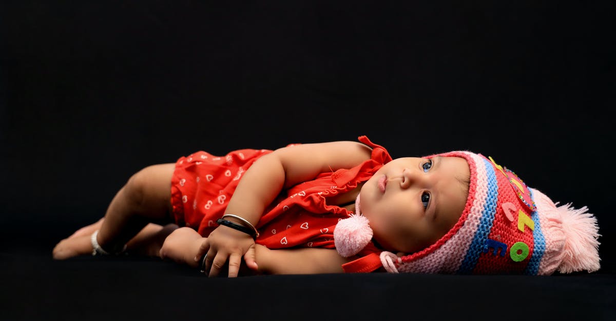 Can I buy a child ticket for my infant baby? - Baby in Red Shirt Lying on Black Textile Can I buy a child ticket for my infant baby? - Baby in Red Shirt Lying on Black Textile