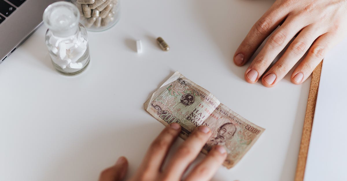 Can I buy malaria medication in India? - Patient giving banknote for pills in hospital Can I buy malaria medication in India? - Patient giving banknote for pills in hospital